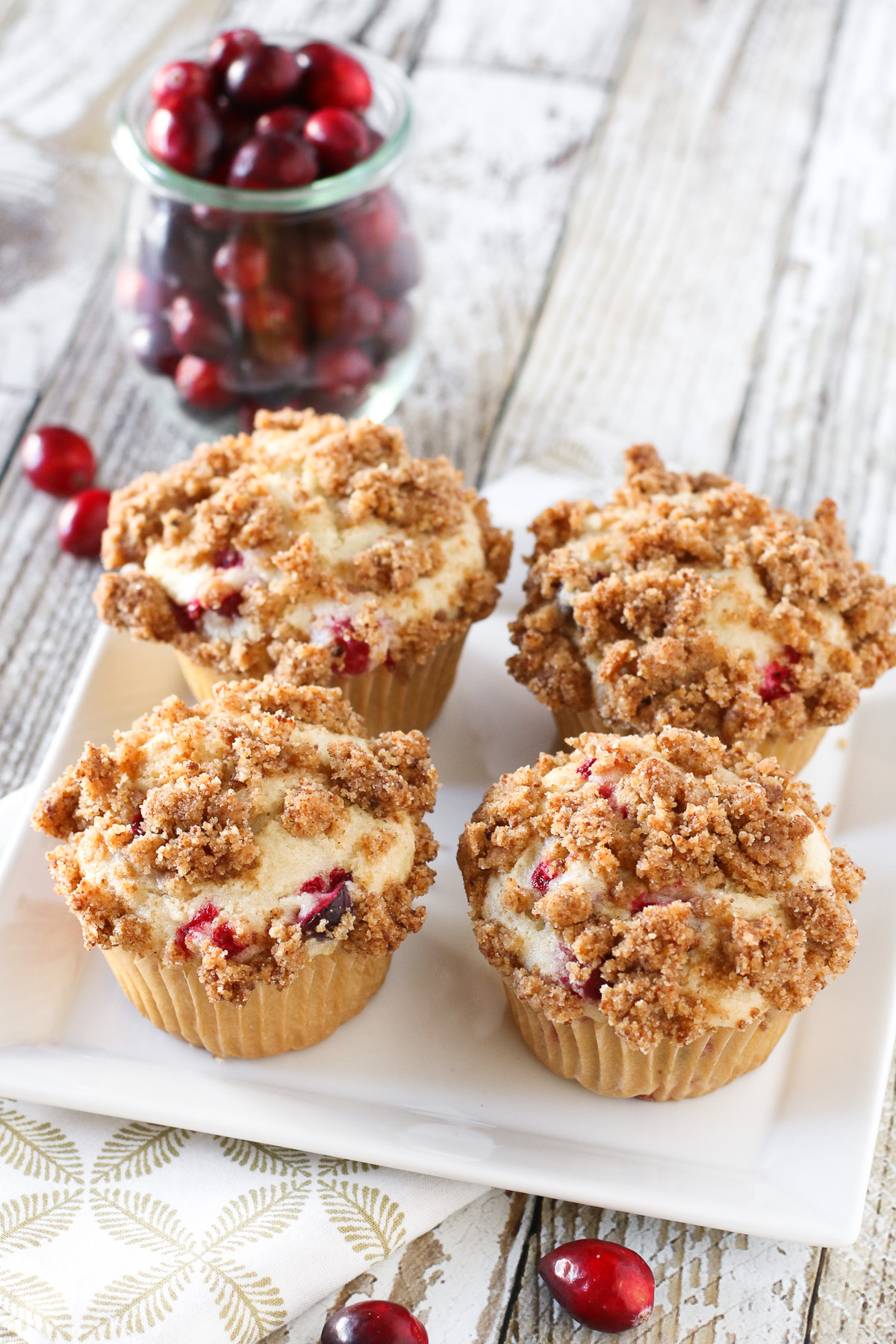 Four Gluten Free Vegan Cranberry Coffeecake Muffins.