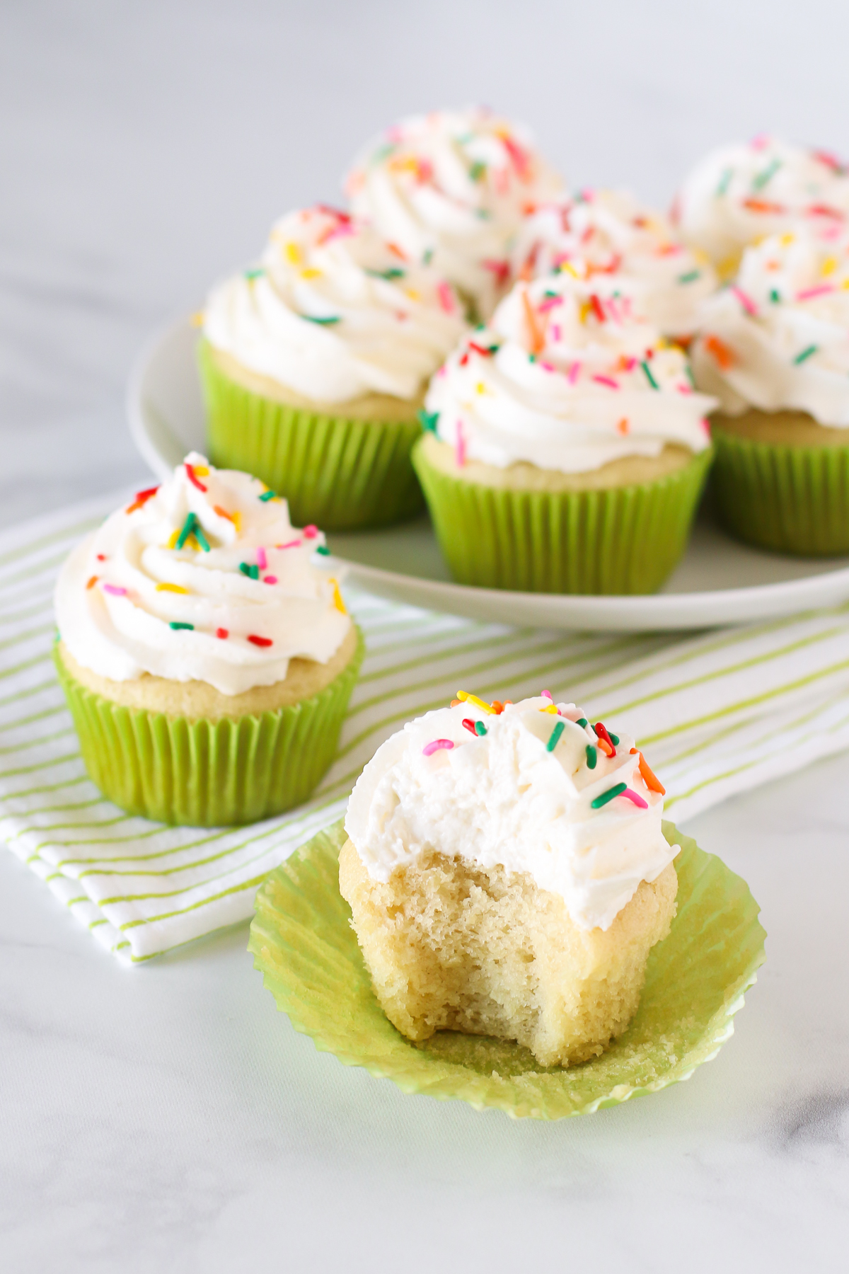 Gluten Free Vegan Vanilla Cupcakes. Light, fluffy cupcakes with a whipped, creamy vanilla buttercream. Allergen free and perfect for any celebration!