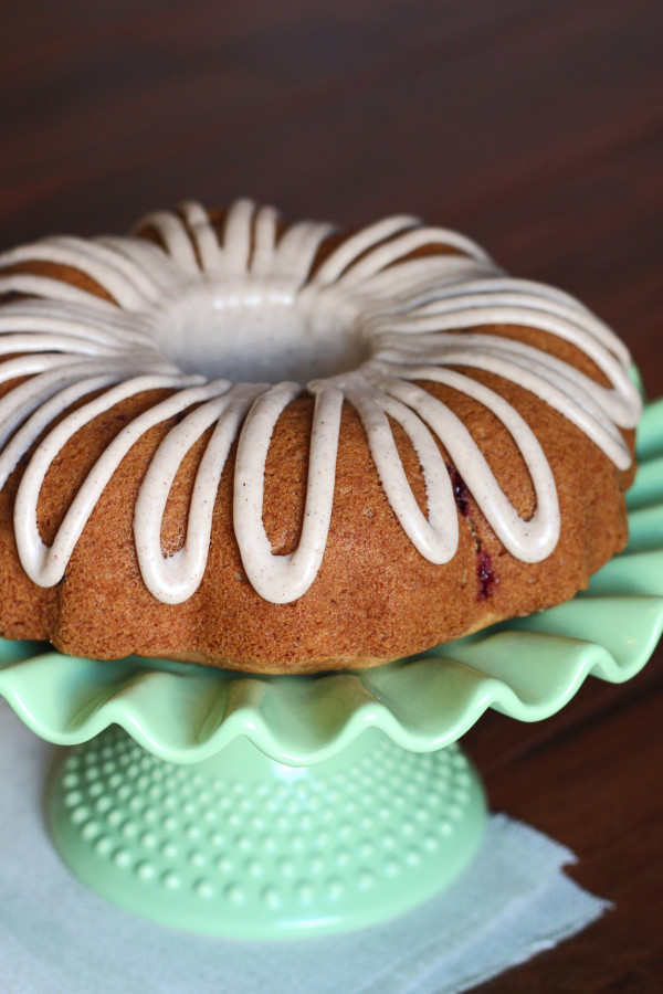 Gluten Free Vegan Apple Cranberry Bundt Cake. Moist apple cake, studded with fresh cranberries and topped with a cinnamon glaze.