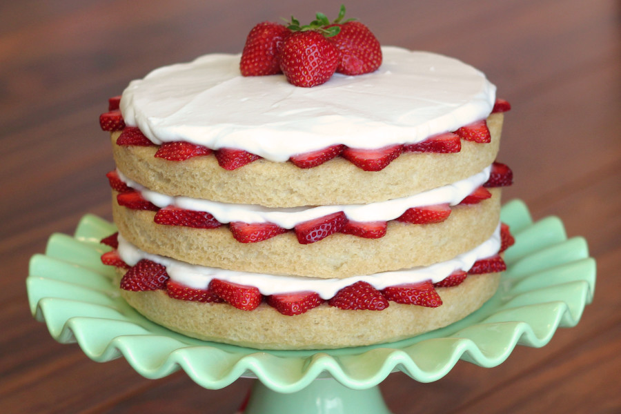 Gluten Free Vegan Strawberry Shortcake. Layers of fluffy vanilla cake, fresh strawberries and whipped coconut cream. 