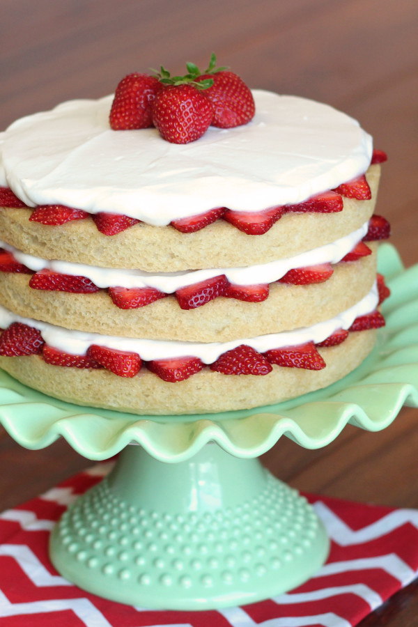 Gluten Free Vegan Strawberry Shortcake. Layers of fluffy vanilla cake, fresh strawberries and whipped coconut cream. 