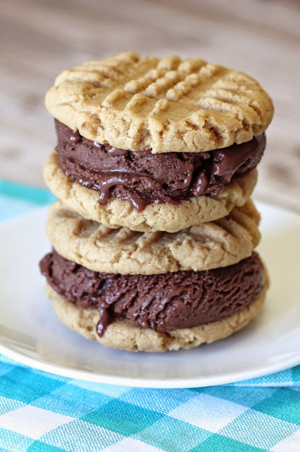 Gluten Free Vegan Peanut Butter Chocolate Ice Cream Sandwiches. Creamy, dairy free chocolate ice cream, sandwiched between two soft peanut butter cookies. Ice cream sandwich perfection.