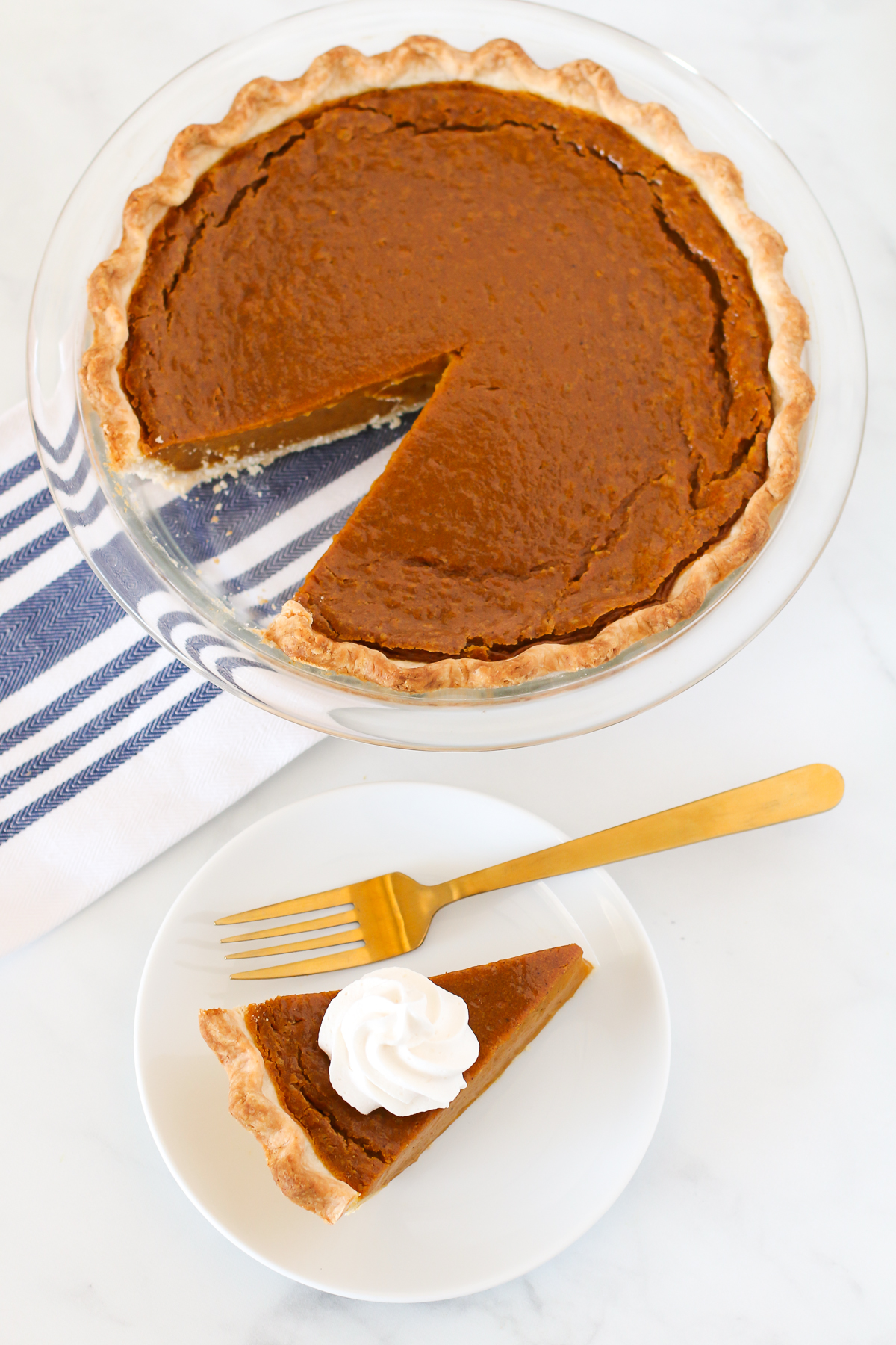 Gluten Free Vegan Pumpkin Pie. Flakey pie crust with a creamy, perfectly spiced pumpkin filling. This pumpkin pie is suitable for any holiday gathering!
