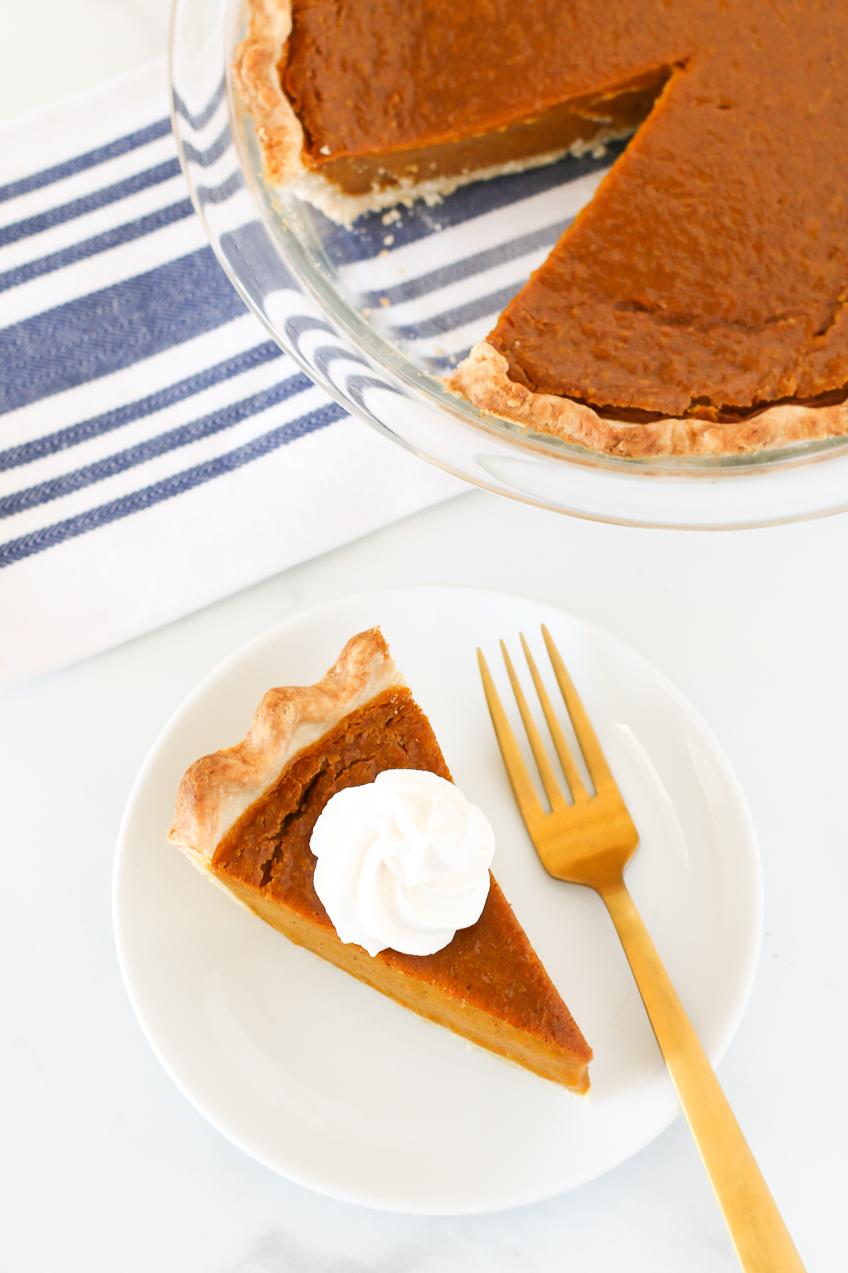 Gluten Free Vegan Pumpkin Pie. Flakey crust with a creamy, perfectly spiced pumpkin filling. This pumpkin pie is suitable for any holiday gathering!