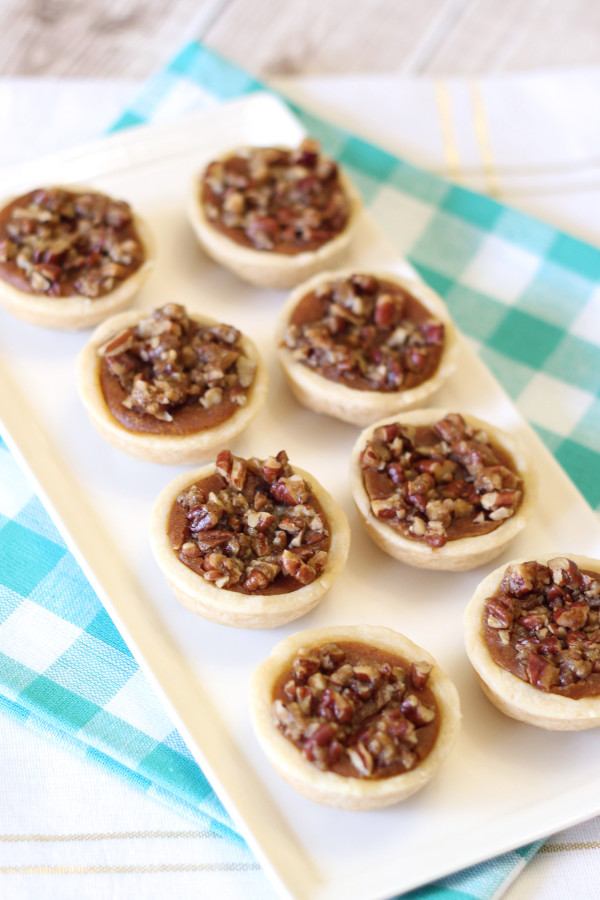 Gluten Free Vegan Mini Pumpkin Pecan Tartlets. Flakey crust, pumpkin filling and sugary pecans. Bite size deliciousness!