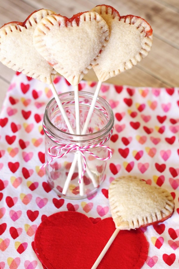 Gluten Free Vegan Heart Strawberry Pie Pops. Adorable little heart-shaped pie pops, filled with your favorite strawberry jam.