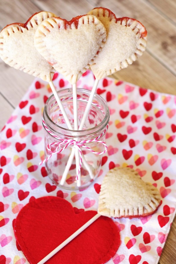 Gluten Free Vegan Heart Strawberry Pie Pops. Adorable little heart-shaped pie pops, filled with your favorite strawberry jam.