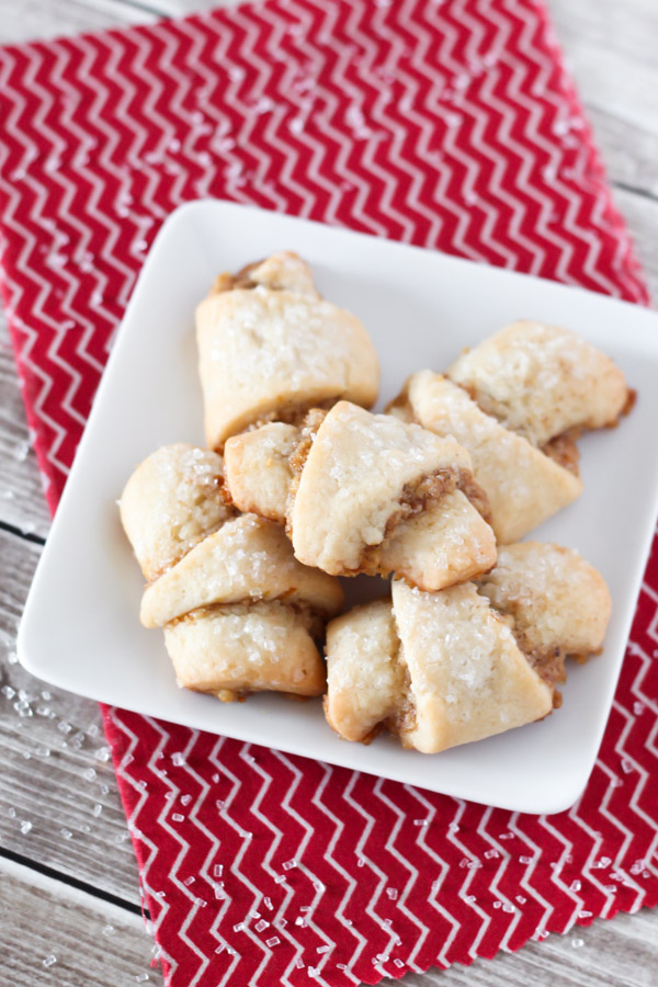 Gluten Free Vegan Walnut Crescent Cookies. Soft crescent cookies with a cinnamon walnut filling and a sprinkling of sparkling sugar on top.