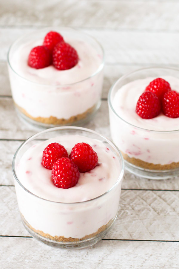 Gluten Free Vegan No-Bake Raspberry Cheesecakes. One bite and you'll be in dairy free cheesecake heaven!