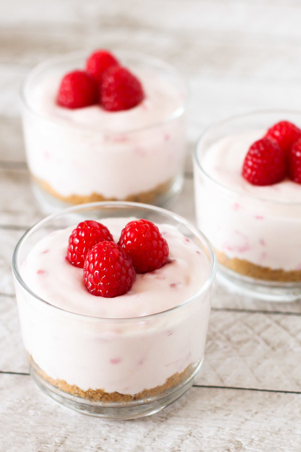 Gluten Free Vegan No-Bake Raspberry Cheesecakes. One bite and you'll be in dairy free cheesecake heaven!