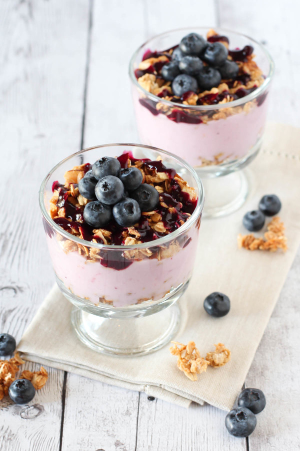 Gluten Free Vegan Blueberry Breakfast Parfaits. Crunchy almond granola, creamy dairy free yogurt with a homemade blueberry sauce!