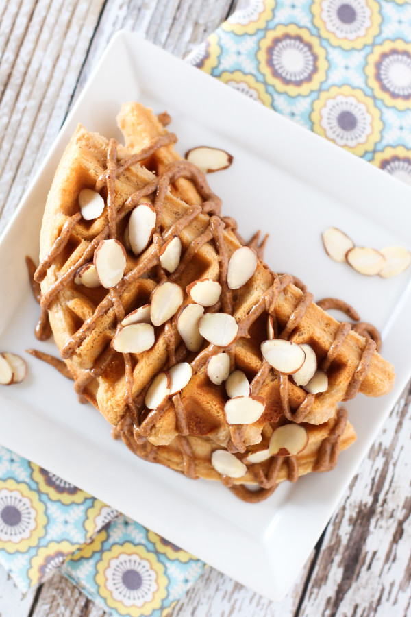 Gluten Free Vegan Vanilla Almond Protein Pancakes. With protein powder, almond flour, almond milk and a drizzle of almond butter, these waffles are PACKED with protein!