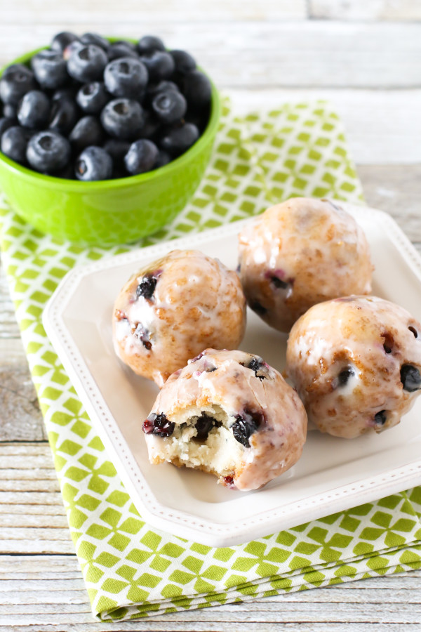 Gluten Free Vegan Blueberry Donut Holes. Crispy on the outside, fluffy on the inside. These donut holes are BURSTING with fresh blueberries!