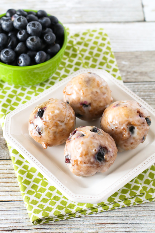 Gluten Free Vegan Blueberry Donut Holes. Crispy on the outside, fluffy on the inside. These donut holes are BURSTING with fresh blueberries!