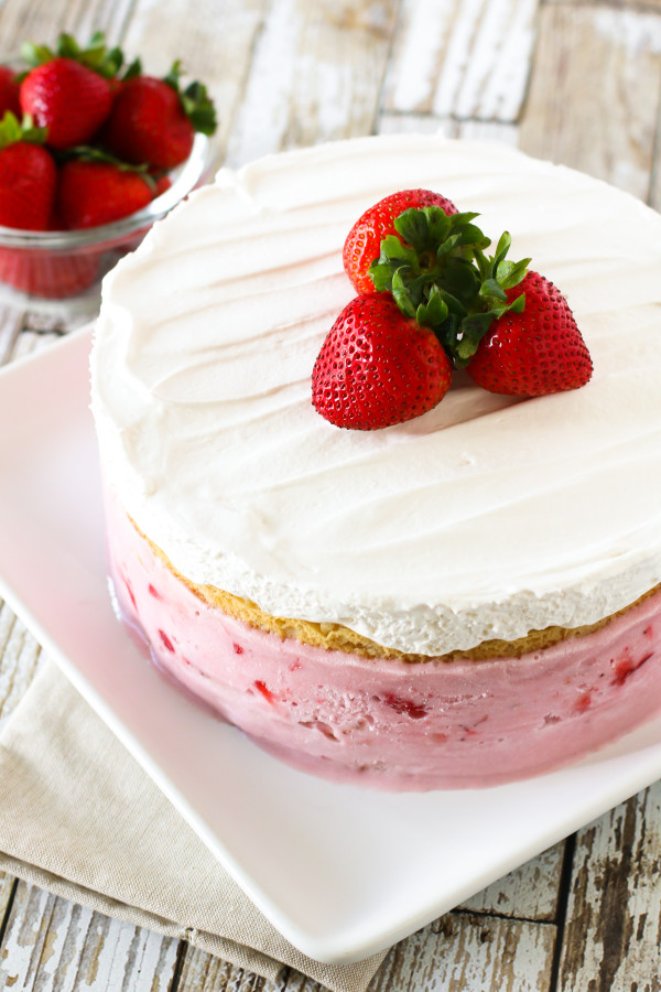 Gluten Free Vegan Strawberry Ice Cream Cake. Layers of vanilla cake, So Delicious Dairy Free strawberry ice cream and creamy Cocowhip. A gorgeous frozen treat!