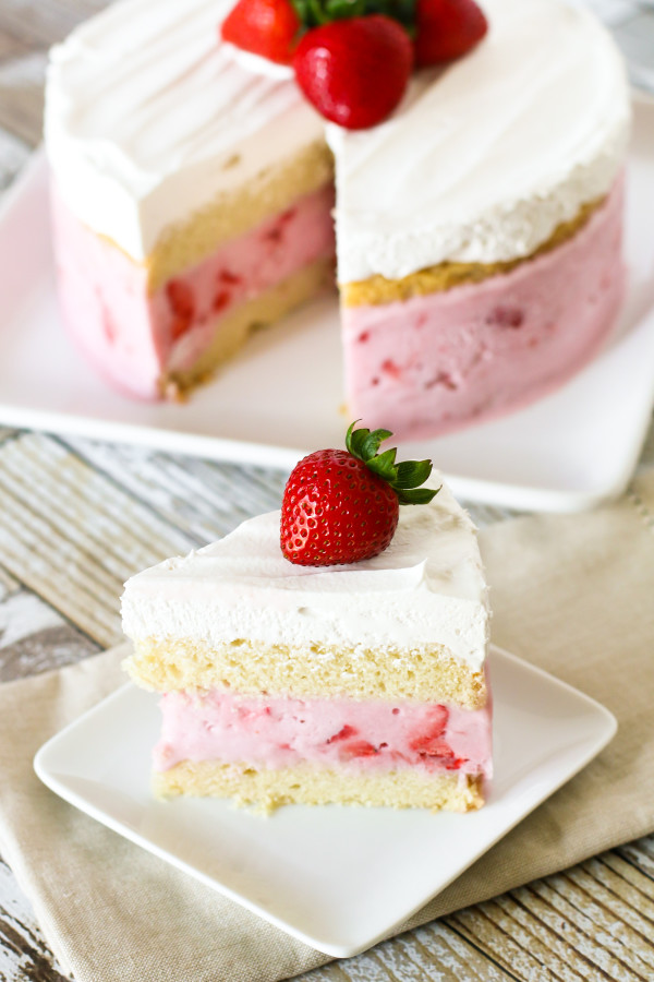 Gluten Free Vegan Strawberry Ice Cream Cake. Layers of vanilla cake, So Delicious Dairy Free strawberry ice cream and creamy Cocowhip. A gorgeous frozen treat!