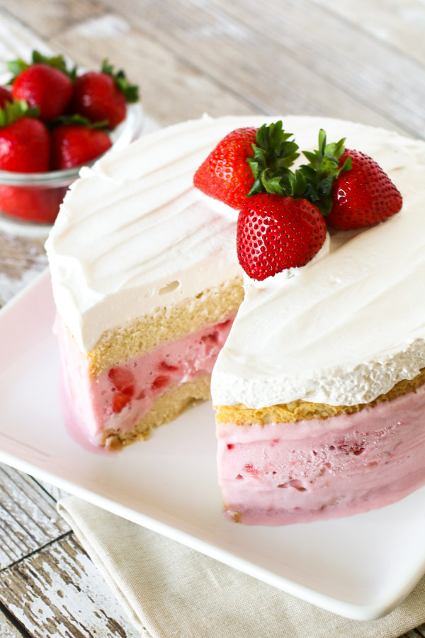 Gluten Free Vegan Strawberry Ice Cream Cake. Layers of vanilla cake, So Delicious Dairy Free strawberry ice cream and creamy Cocowhip. A gorgeous frozen treat!