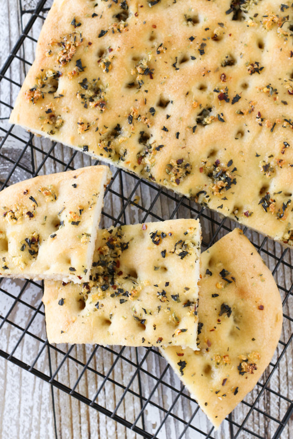 Gluten Free Vegan Garlic Herb Focaccia Bread. Warm, soft yeast free bread, covered in herbs and fresh garlic. Oh so good! 