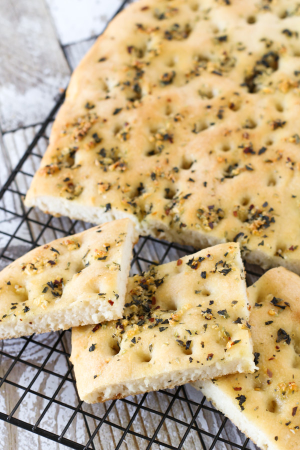 Gluten Free Vegan Garlic Herb Focaccia Bread. Warm, soft yeast free bread, covered in herbs and fresh garlic. Oh so good! 