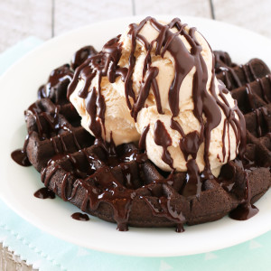 Gluten Free Vegan Chocolate Fudge Waffle Sundaes. Chewy chocolate waffles, topped with vanilla ice cream and warm chocolate ganache. HEAVENLY!