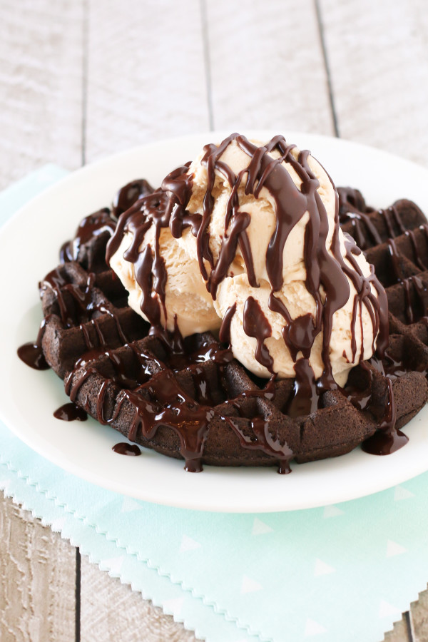 Gluten Free Vegan Chocolate Fudge Waffle Sundaes. Chewy chocolate waffles, topped with vanilla ice cream and warm chocolate ganache. HEAVENLY!