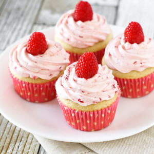 Gluten Free Vegan Raspberry Vanilla Cupcakes. Fluffy vanilla cupcake, topped with a fresh raspberry buttercream. Delightful!
