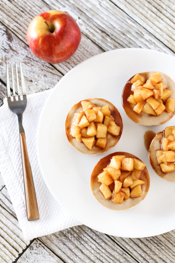 Gluten Free Vegan Mini Apple Cinnamon Cheesecakes. Individual no-bake dairy free cheesecakes, loaded with cinnamon and topped with sweet apples.