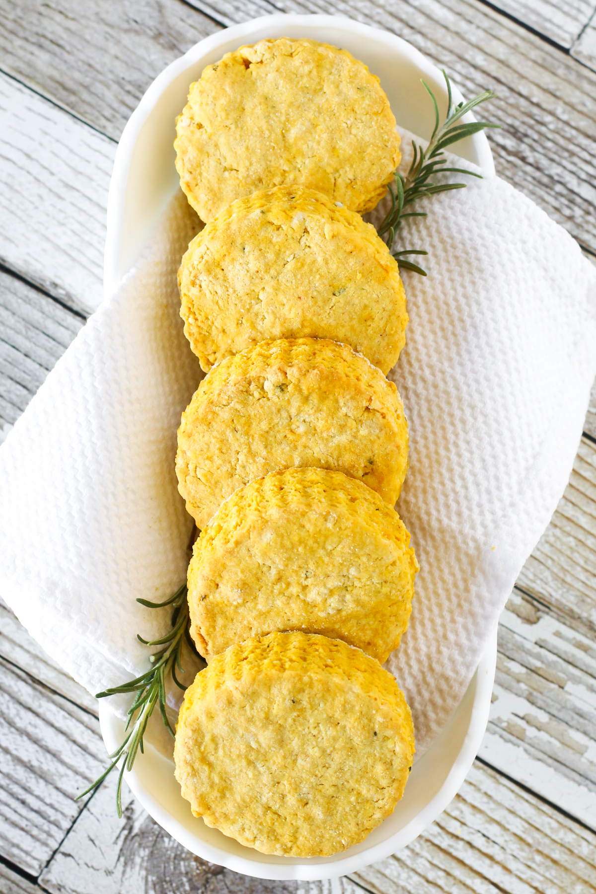 Gluten Free Vegan Rosemary Pumpkin Biscuits. With flavors of pumpkin and rosemary, these biscuits are perfect served with any hearty soup!
