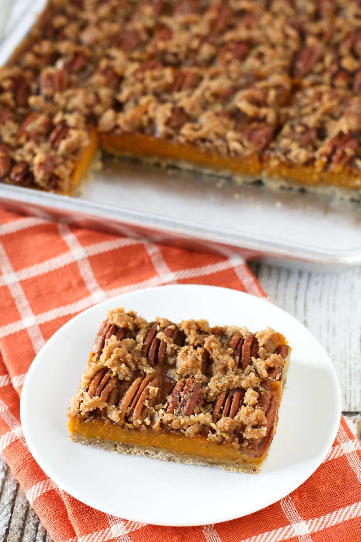 Gluten Free Vegan Pecan Pumpkin Pie Bars. Oat crust, creamy pumpkin filling and sugar crumble pecan topping. Easy-peasy and a fall favorite!