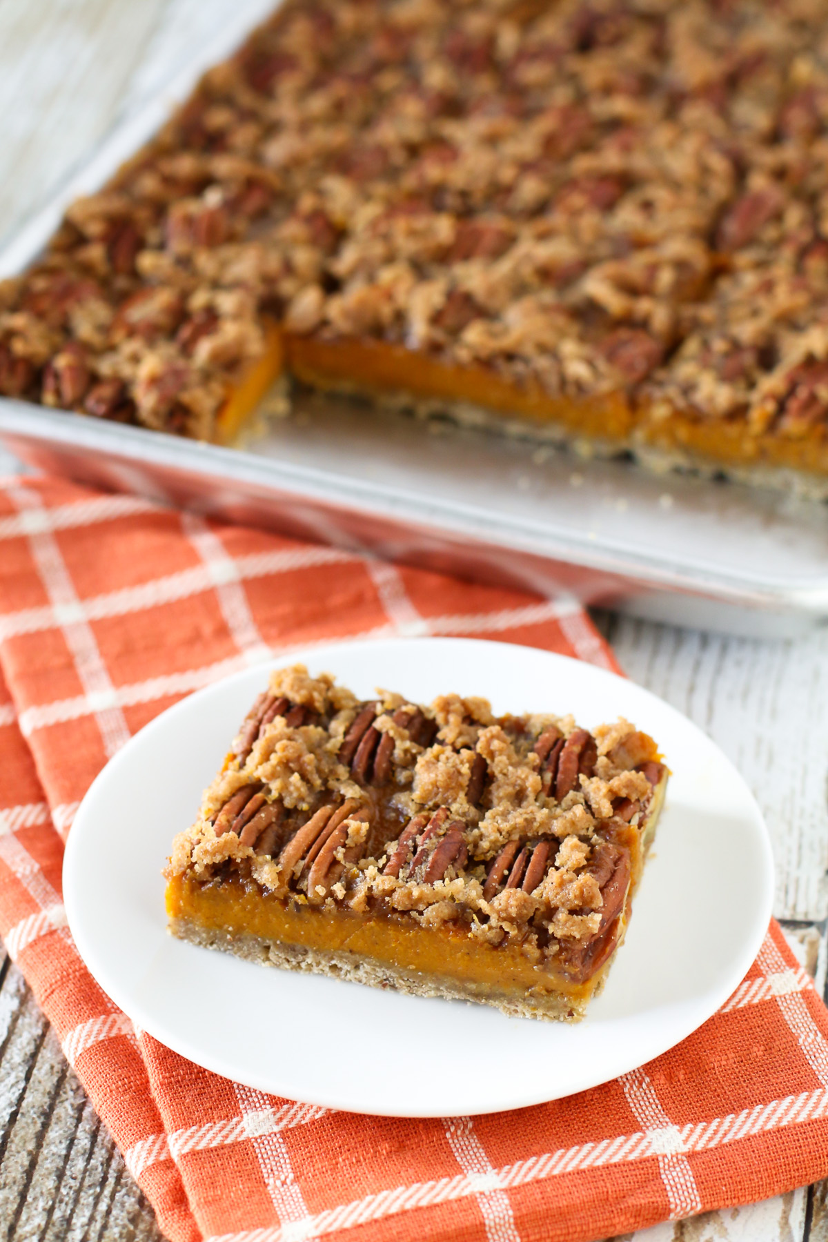 Gluten Free Vegan Pecan Pumpkin Pie Bars. Oat crust, creamy pumpkin filling and sugar crumble pecan topping. Easy-peasy and a fall favorite!