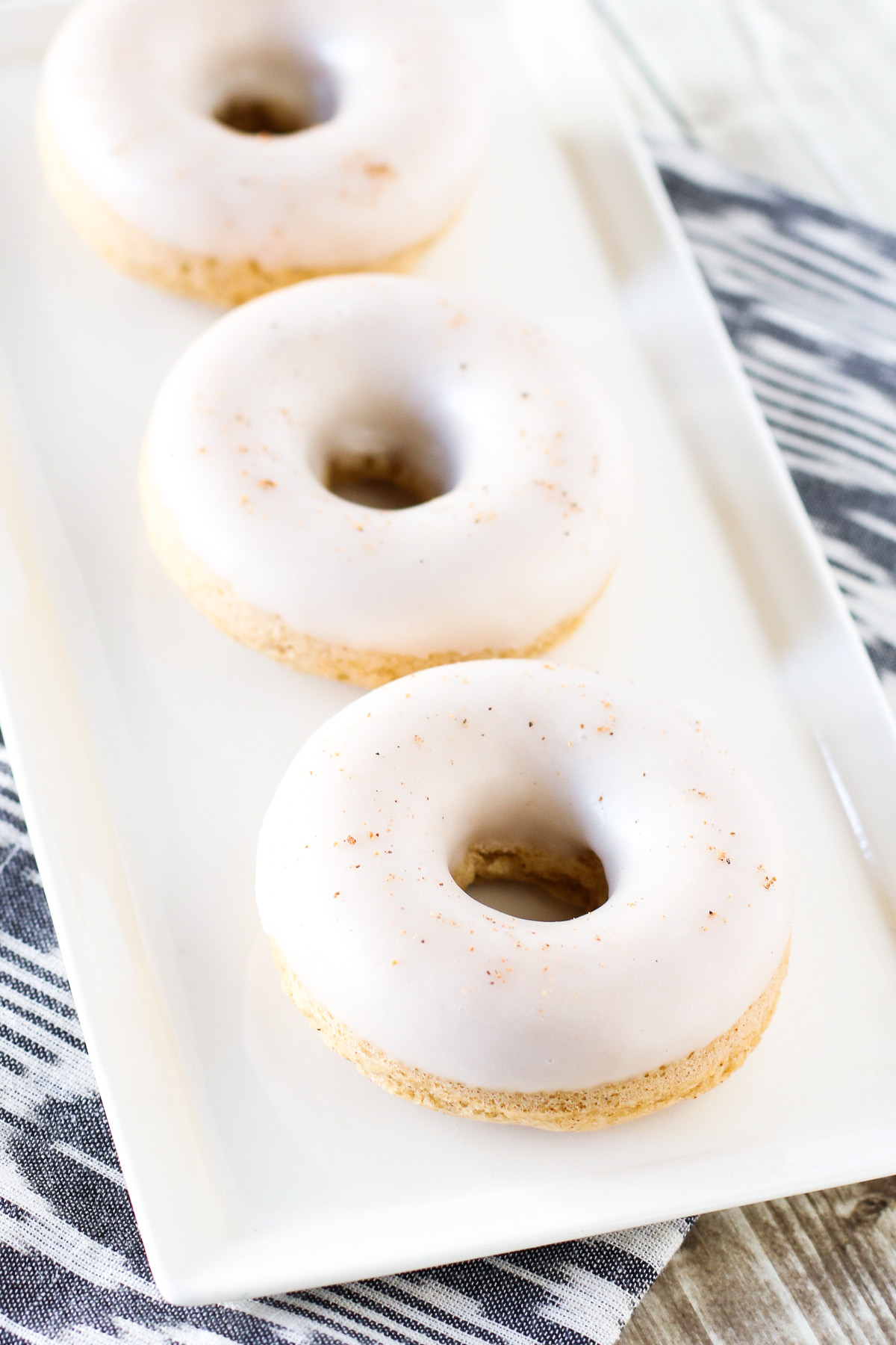 Gluten Free Vegan Baked Eggnog Donuts. Holiday flavor of creamy eggnog in these fluffy baked donuts.