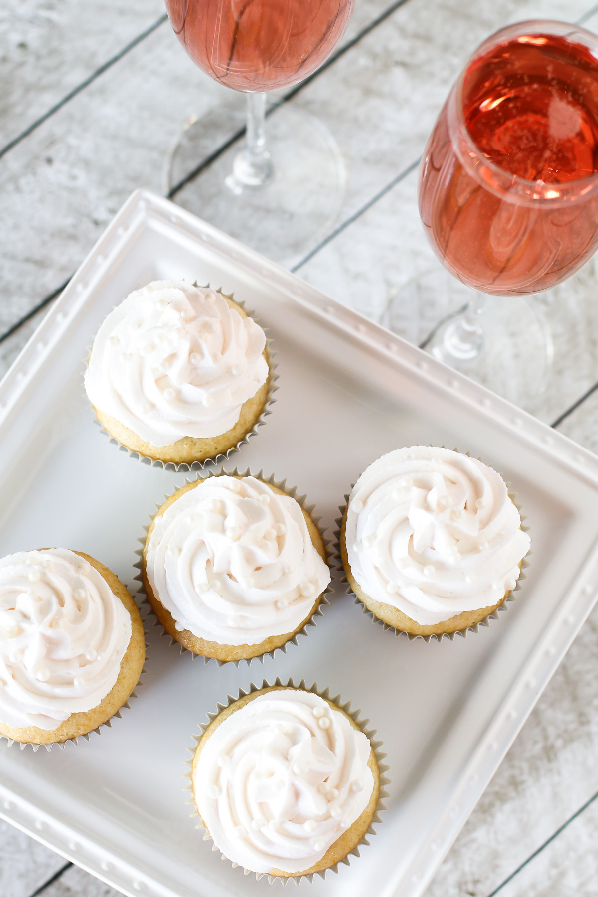 Gluten Free Vegan Champagne Cupcakes. Light vanilla cupcakes, infused with champagne and topped with a champagne buttercream. Cheers!