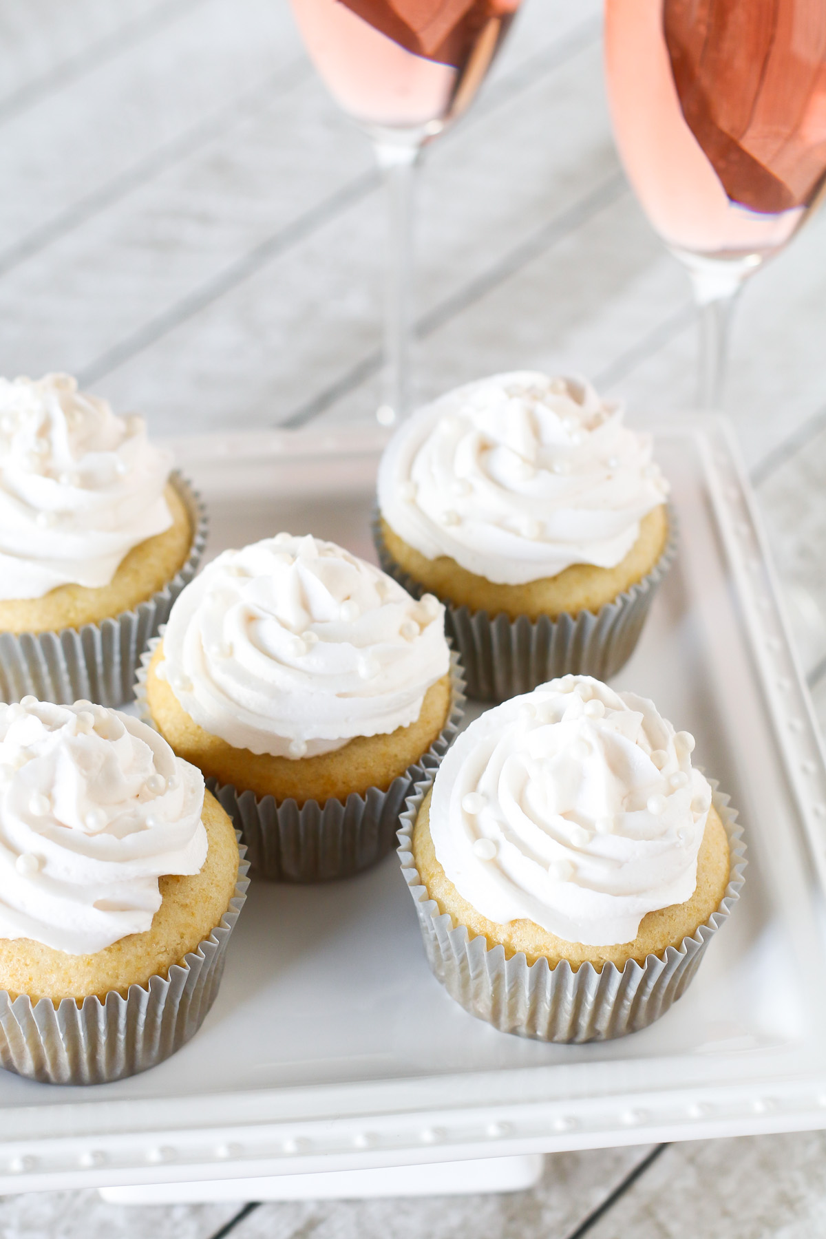 Gluten Free Vegan Champagne Cupcakes. Light vanilla cupcakes, infused with champagne and topped with a champagne buttercream. Cheers!