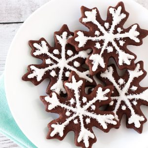 Gluten Free Vegan Chocolate Snowflake Sugar Cookies. Beautiful chocolate snowflakes, with a simple glaze and sparkling sugar.