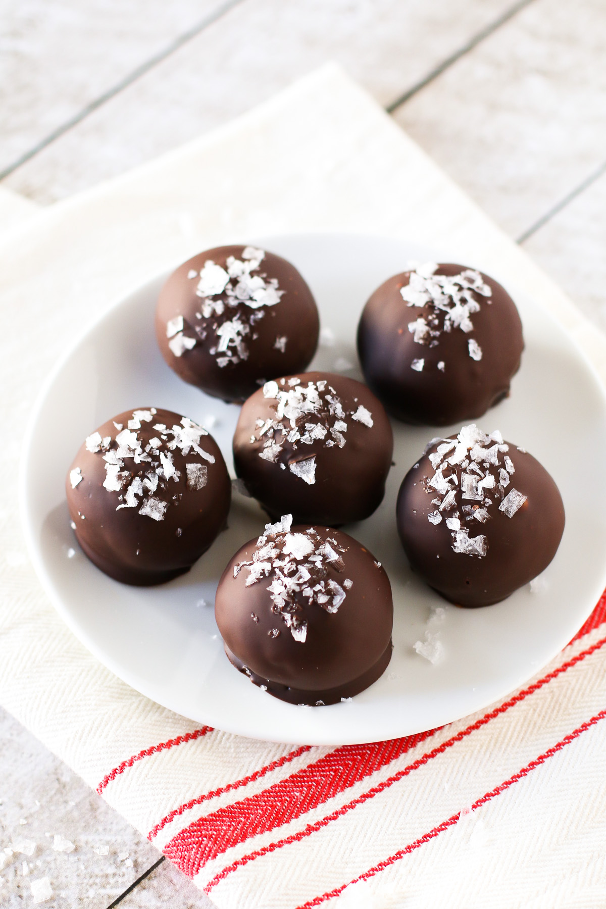 Gluten Free Vegan Sea Salt Brownie Truffles. These decadent brownie truffles are coated in dark chocolate and a sprinkling of sea salt flakes.