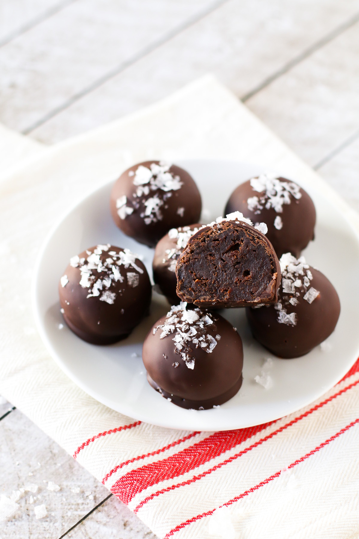 Gluten Free Vegan Sea Salt Brownie Truffles. These decadent brownie truffles are coated in dark chocolate and a sprinkling of sea salt flakes.