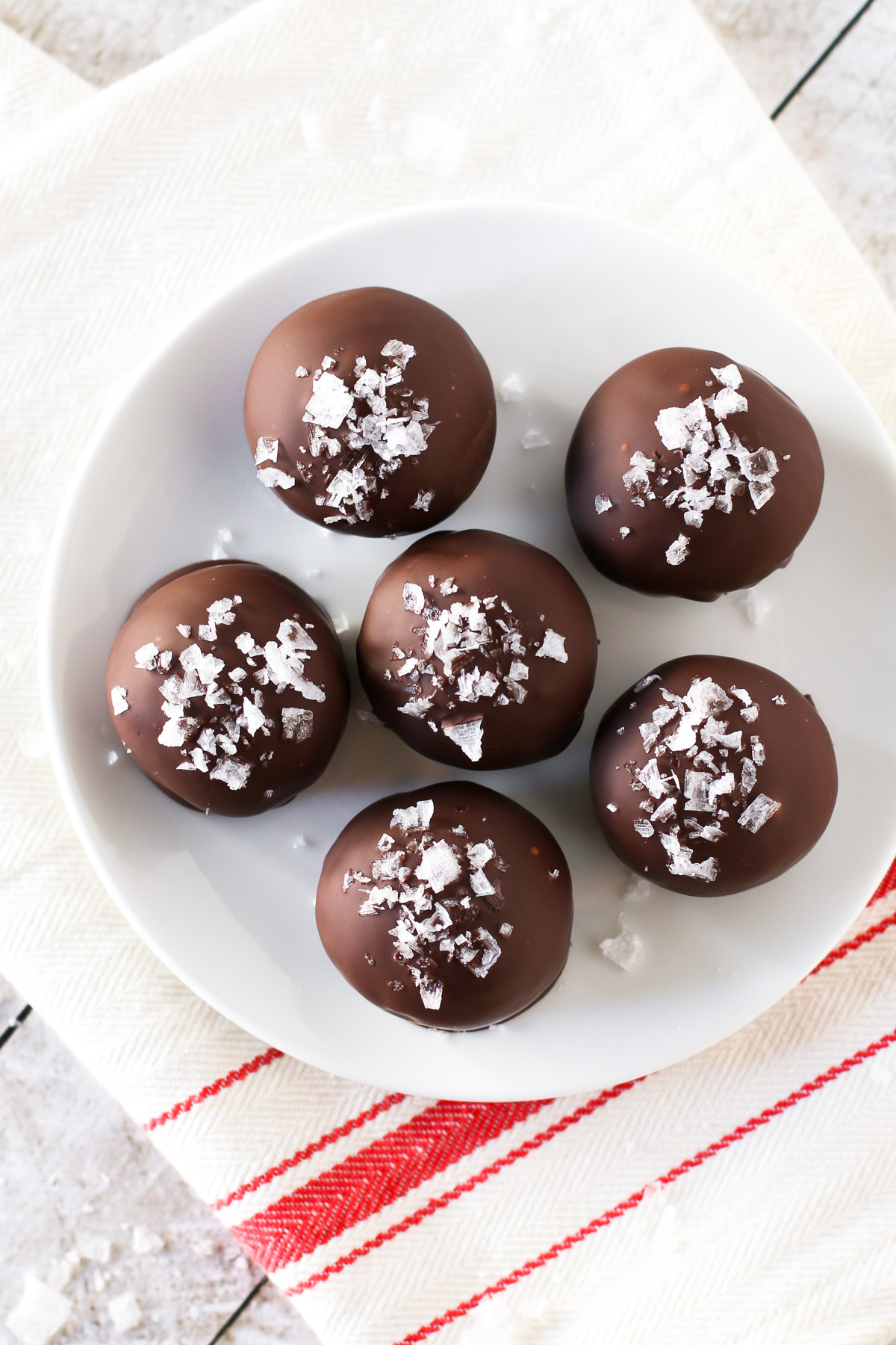 Gluten Free Vegan Sea Salt Brownie Truffles. These decadent brownie truffles are coated in dark chocolate and a sprinkling of sea salt flakes.