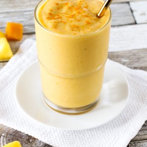 Dairy Free Golden Turmeric Smoothie. Made with frozen tropical fruit, coconut milk, turmeric and ginger. So many good things!