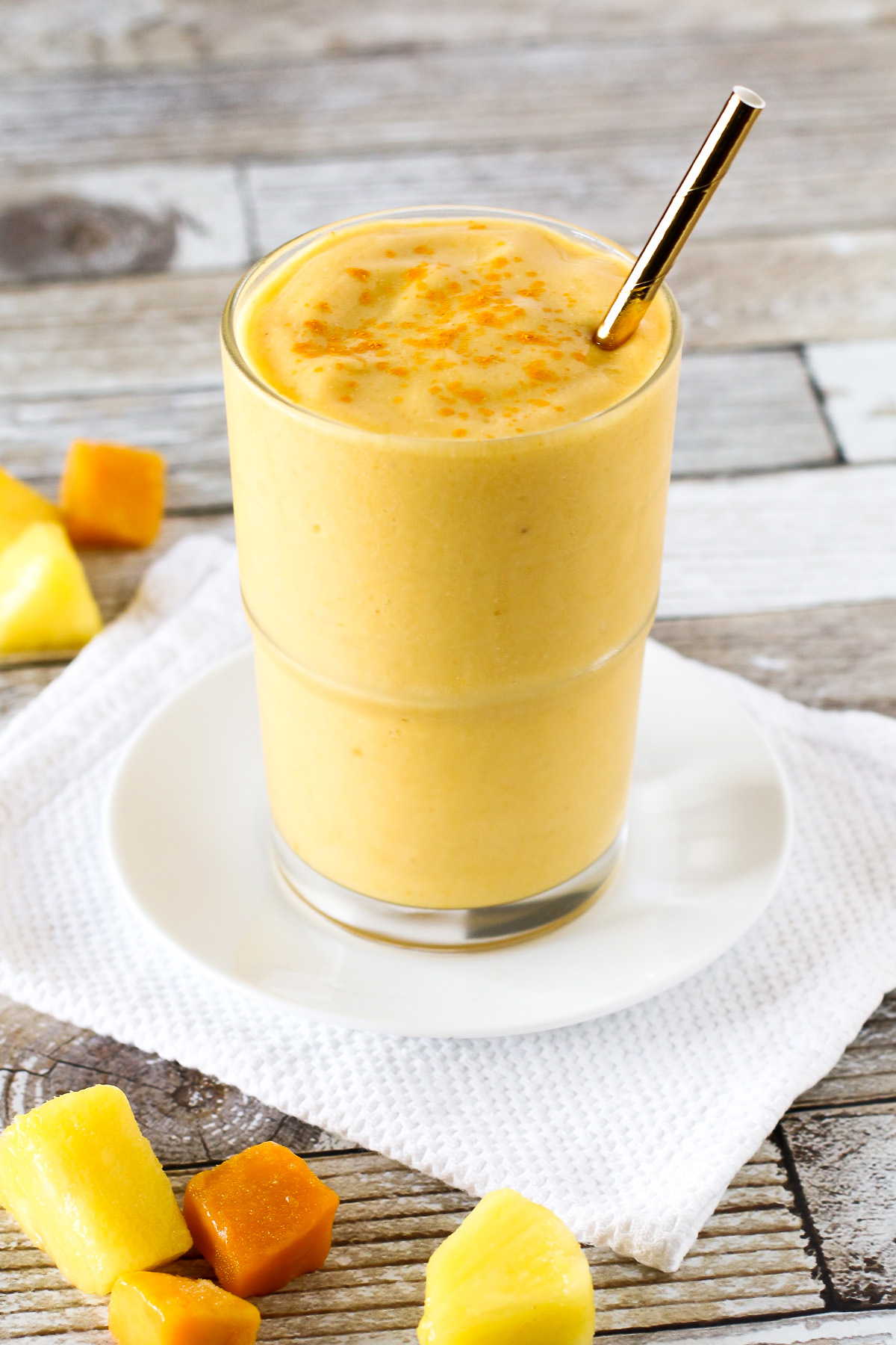 Dairy Free Golden Turmeric Smoothie. Made with frozen tropical fruit, coconut milk, turmeric and ginger. So many good things!