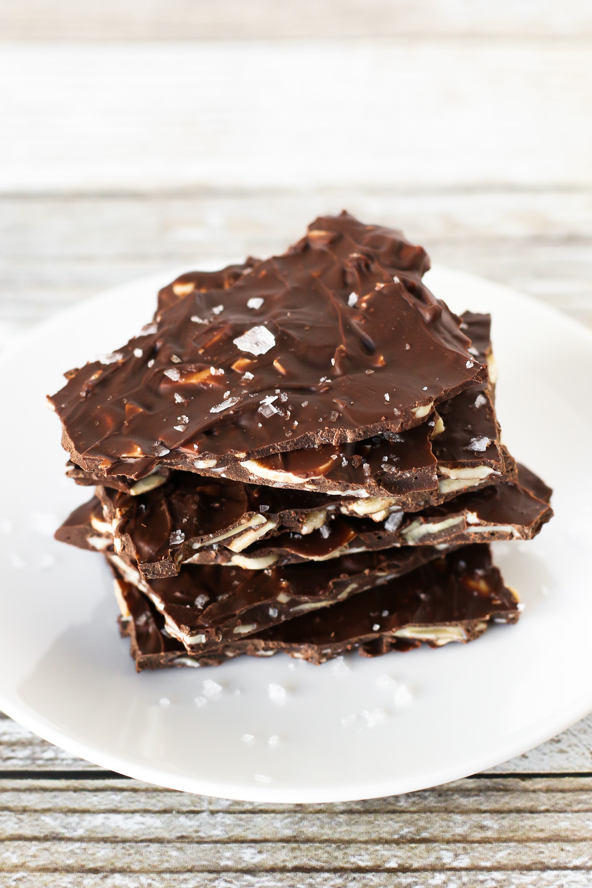 Sea Salt Chocolate Almond Bark. Thin layer of toasted sliced almonds, coated in chocolate and sprinkled with flaked sea salt. 