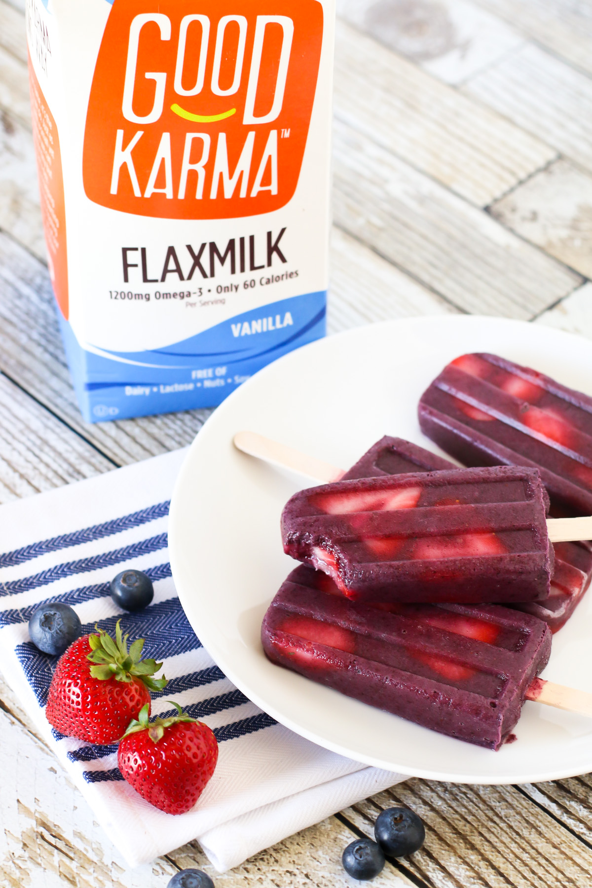 Berry Smoothie Popsicles. Made with Good Karma Flaxmilk, these berry smoothie popsicles are perfect for summer!