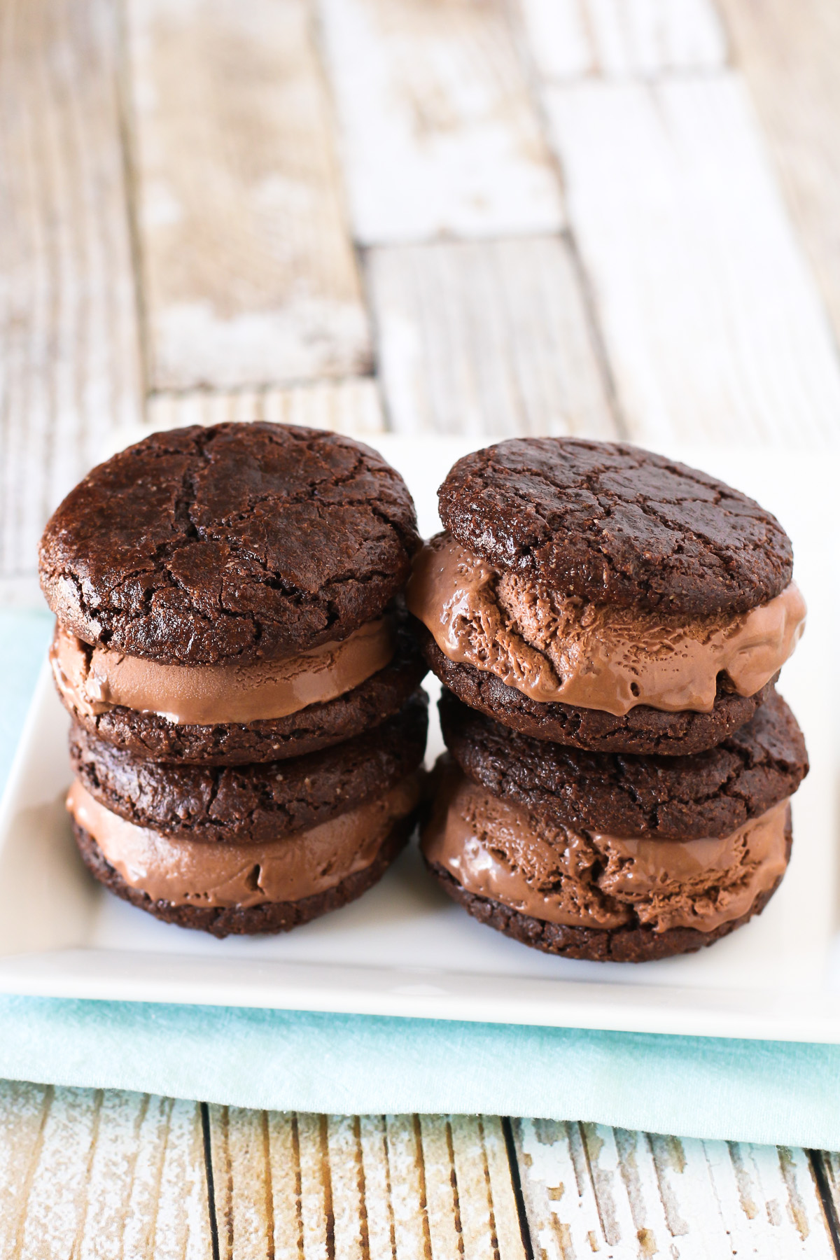 Gluten Free Vegan Brownie Ice Cream Sandwiches. Chewy brownie cookies, filled with creamy dairy free chocolate ice cream. Incredibly decadent and insanely delicious!