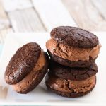 Gluten Free Vegan Brownie Ice Cream Sandwiches. Chewy brownie cookies, filled with creamy dairy free chocolate ice cream. Incredibly decadent and insanely delicious!