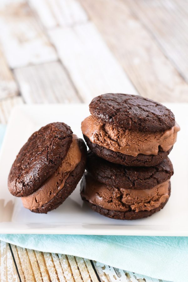 Gluten Free Vegan Brownie Ice Cream Sandwiches. Chewy brownie cookies, filled with creamy dairy free chocolate ice cream. Incredibly decadent and insanely delicious!