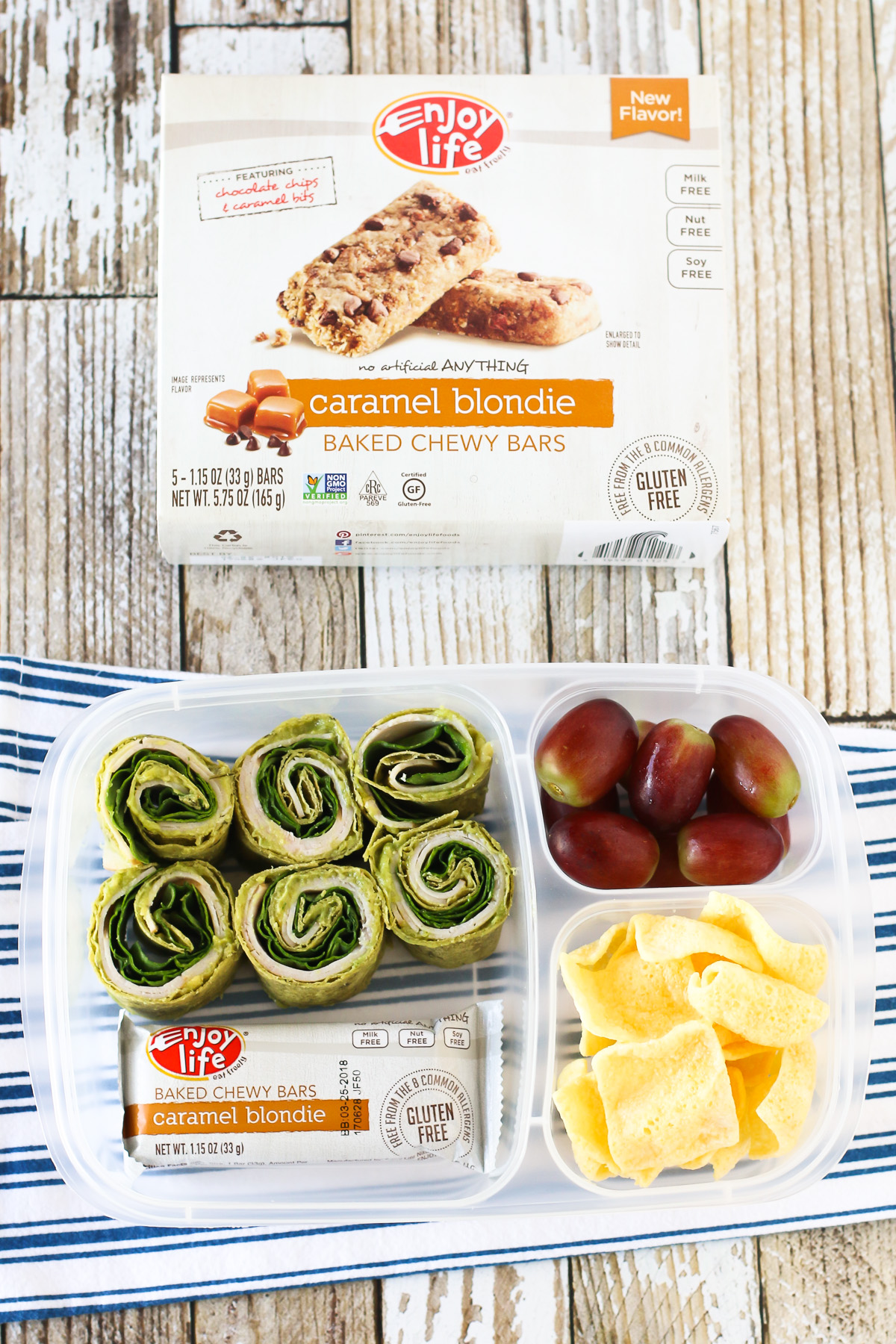 Easy Allergen Free School Lunches. Gluten free turkey, spinach and guacamole pinwheels, served with an Enjoy Life Baked Chewy Bar. 