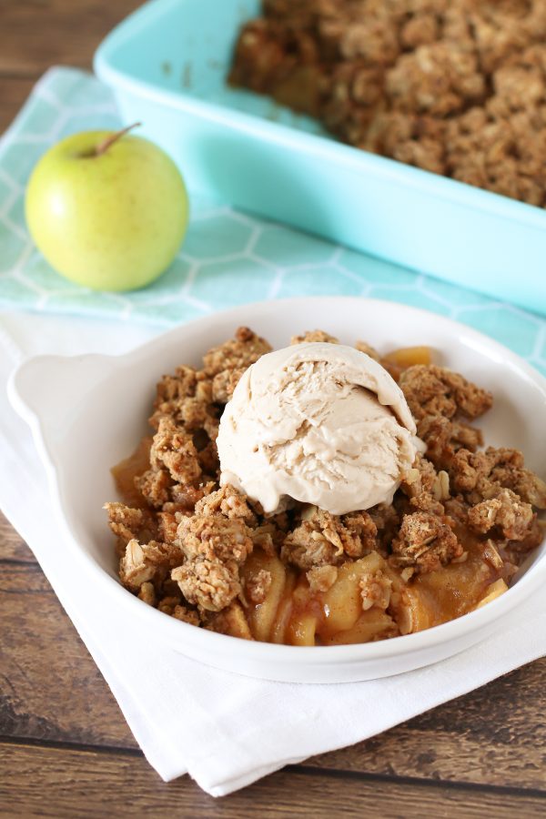 Gluten Free Vegan Apple Crumble. Tender cinnamon apples, topped with a refined sugar free oat crumble. Warm and comforting!