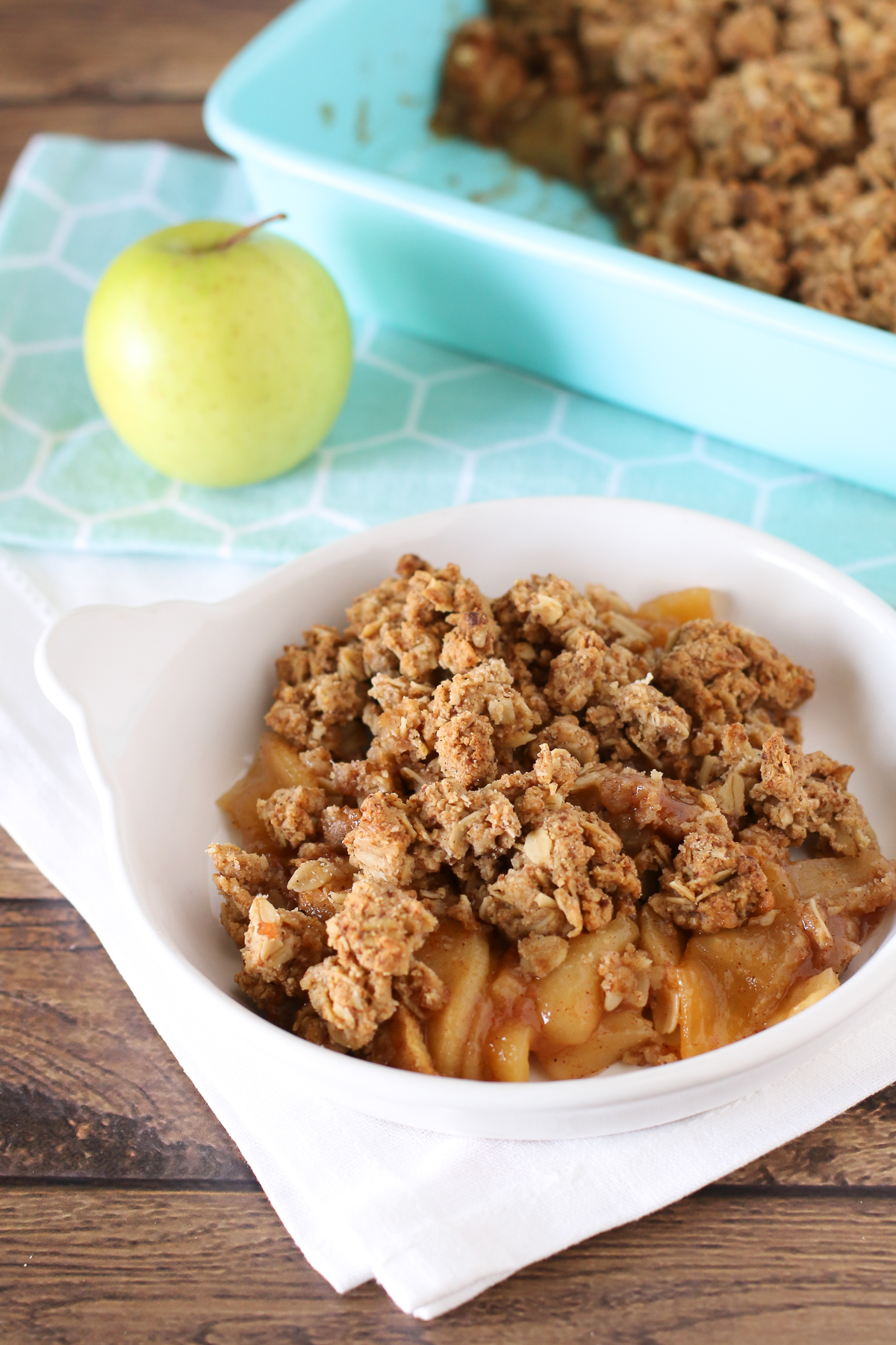 Gluten Free Vegan Apple Crumble. Tender cinnamon apples, topped with a refined sugar free oat crumble. Warm and comforting.