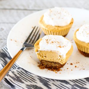 Gluten Free Vegan Mini Pumpkin Cheesecakes. Creamy cashew based cheesecakes with pumpkin and all the fall spices.