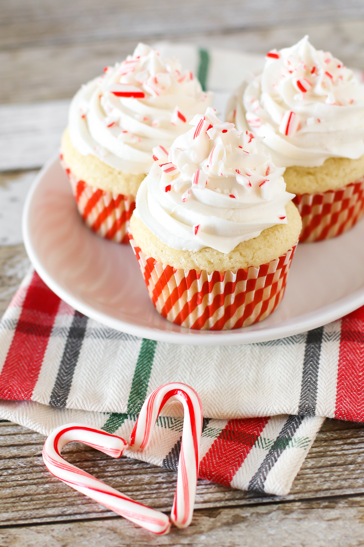 Gluten Free Vegan Candy Cane Cupcakes. Fluffy vanilla peppermint cupcakes with a peppermint buttercream. Tastes just like a candy cane!