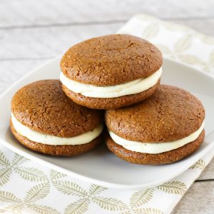 Gluten Free Vegan Gingerbread Whoopie Pies. Soft cake-like gingerbread cookies with a dairy free orange buttercream filling. Heavenly!